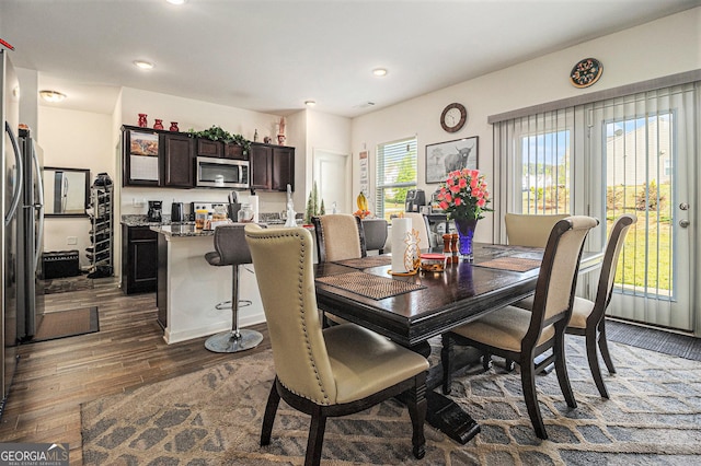 129 Coldwater Way, Griffin, GA 30224 - dining room with bar, visible vents, recessed lighting, and dark wood-type flooring