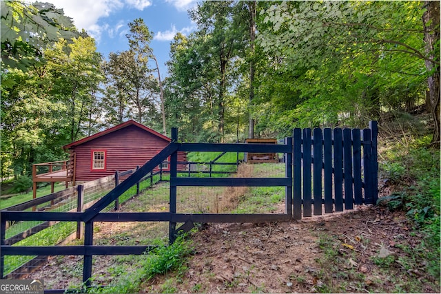 view of gate featuring fence