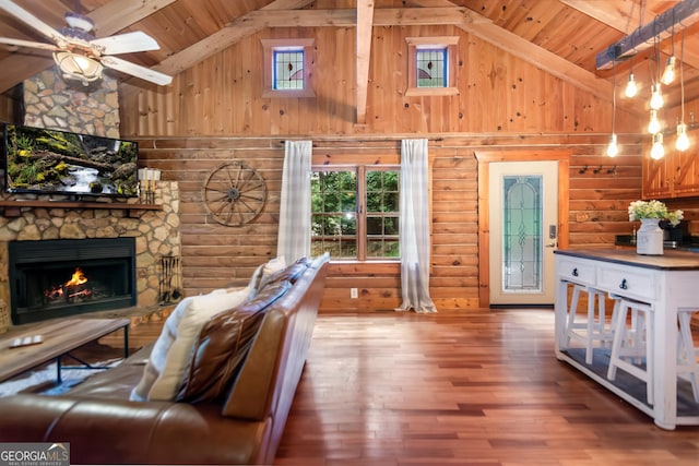 living area featuring high vaulted ceiling, wooden ceiling, and a wealth of natural light