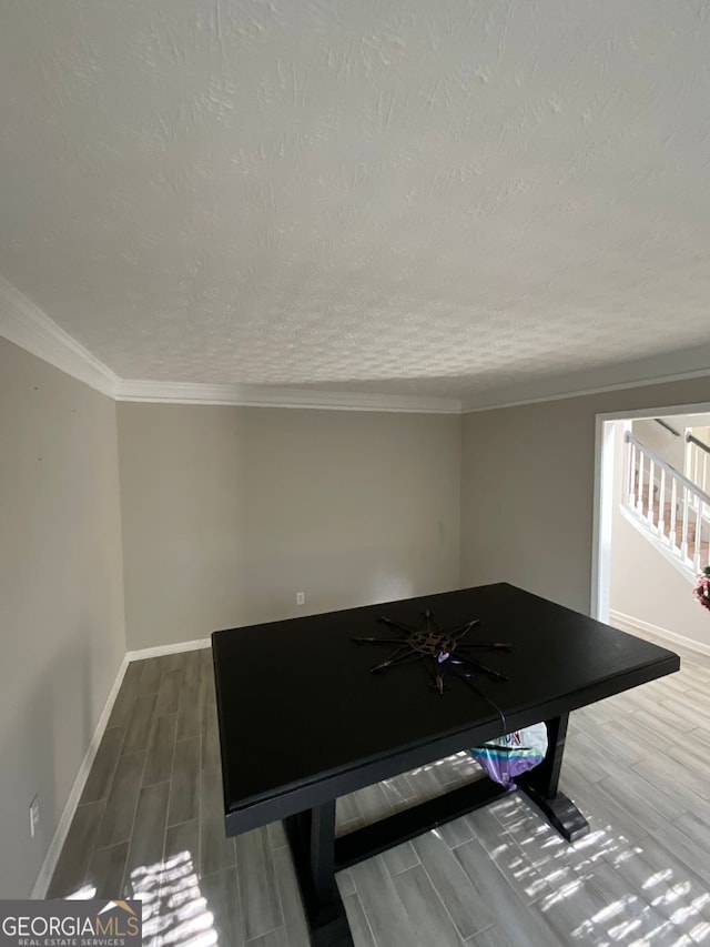 1086 Deshon Trl, Lithonia, GA 30058 - recreation room with wood tiled floors, a textured ceiling, baseboards, and crown molding