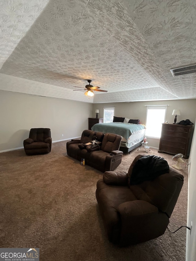 1086 Deshon Trl, Lithonia, GA 30058 - carpeted bedroom featuring a textured ceiling, baseboards, and ceiling fan