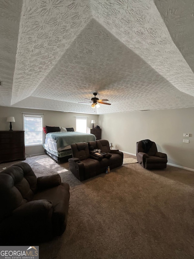 1086 Deshon Trl, Lithonia, GA 30058 - bedroom featuring a textured ceiling, carpet flooring, baseboards, vaulted ceiling, and a ceiling fan