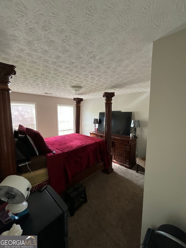 1086 Deshon Trl, Lithonia, GA 30058 - carpeted bedroom with ornate columns and a textured ceiling