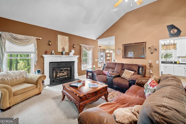614 Springharbor Dr, Woodstock, GA 30188 - living room featuring a ceiling fan, a fireplace with flush hearth, high vaulted ceiling, and carpet