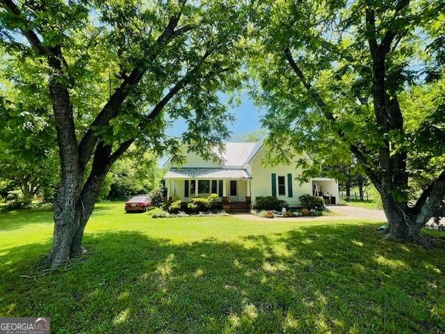 7650 Neese Commerce Rd, Hull, GA 30646 - rear view of house featuring a lawn and metal roof