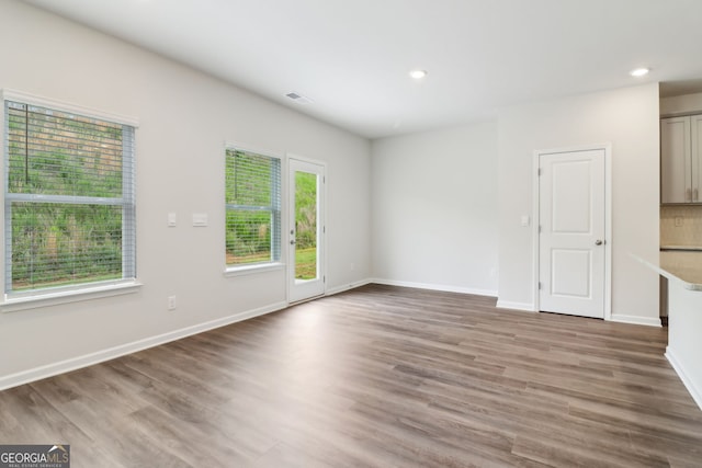 2762 Aralynn Way, College Park, GA 30337 - unfurnished living room with baseboards, visible vents, recessed lighting, and wood finished floors