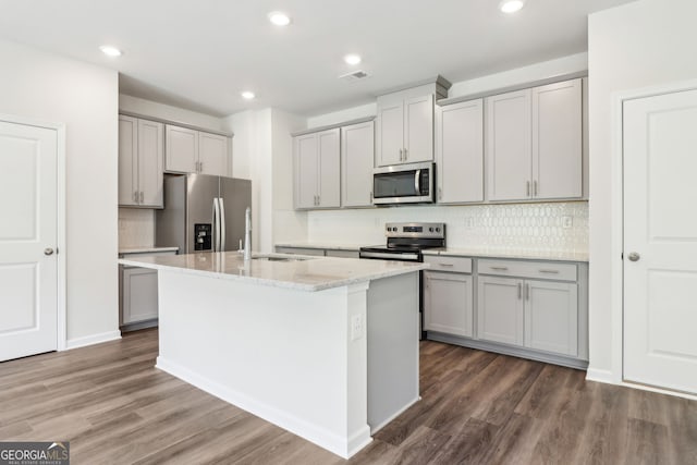 2762 Aralynn Way, College Park, GA 30337 - kitchen featuring a sink, stainless steel appliances, gray cabinets, an island with sink, and dark wood-style flooring