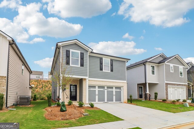 2762 Aralynn Way, College Park, GA 30337 - view of front facade with brick siding, driveway, a garage, a front yard, and cooling unit