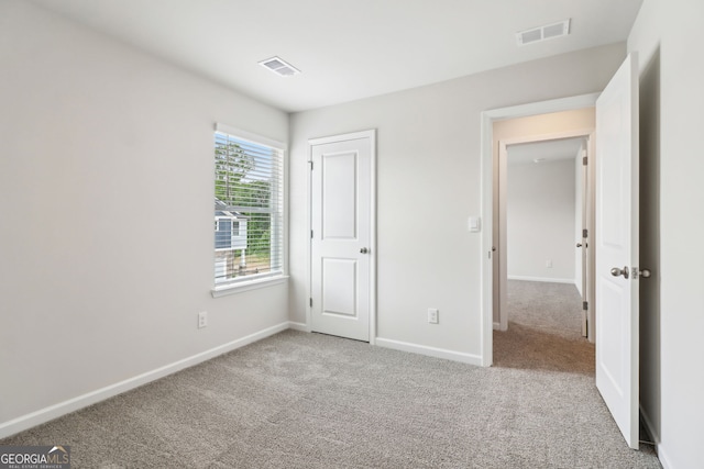 2762 Aralynn Way, College Park, GA 30337 - unfurnished bedroom with carpet flooring, baseboards, and visible vents