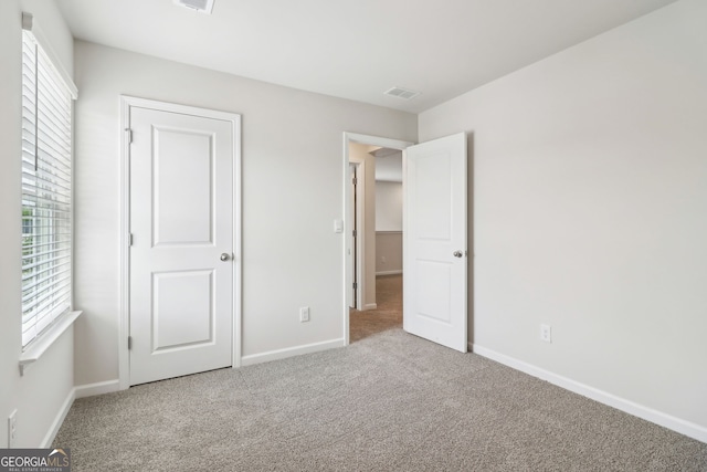 2762 Aralynn Way, College Park, GA 30337 - unfurnished bedroom with baseboards, visible vents, and carpet floors
