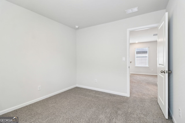 2762 Aralynn Way, College Park, GA 30337 - spare room with baseboards, carpet flooring, and visible vents