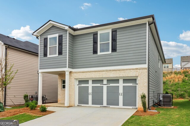 2762 Aralynn Way, College Park, GA 30337 - view of front of property with central AC, driveway, a garage, and a front yard