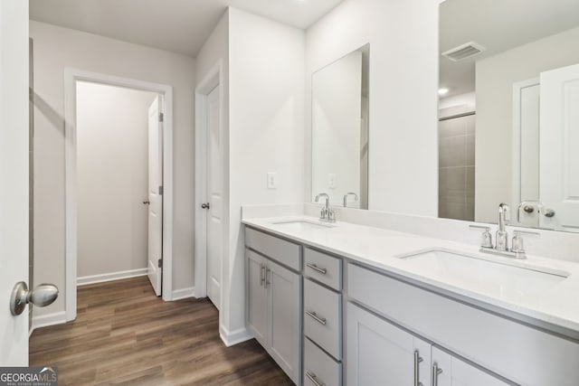 2762 Aralynn Way, College Park, GA 30337 - bathroom with a sink, baseboards, visible vents, and wood finished floors