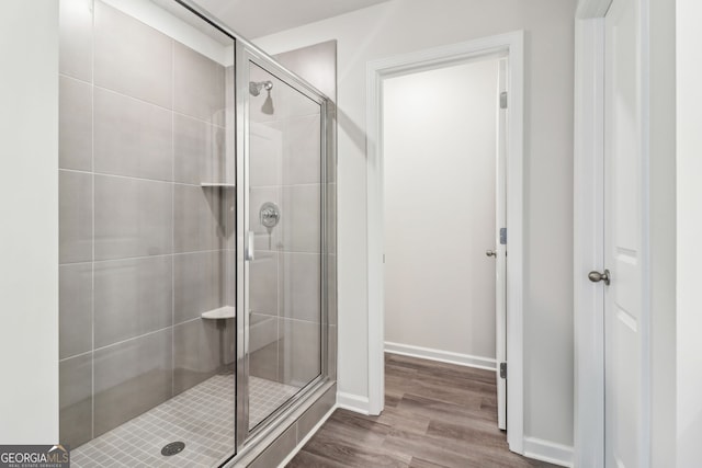 2762 Aralynn Way, College Park, GA 30337 - bathroom featuring a shower stall, baseboards, and wood finished floors