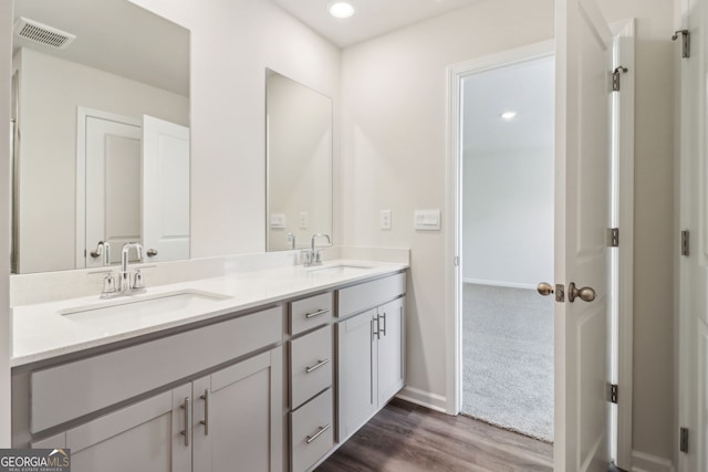 2762 Aralynn Way, College Park, GA 30337 - full bath featuring a sink, double vanity, visible vents, and wood finished floors