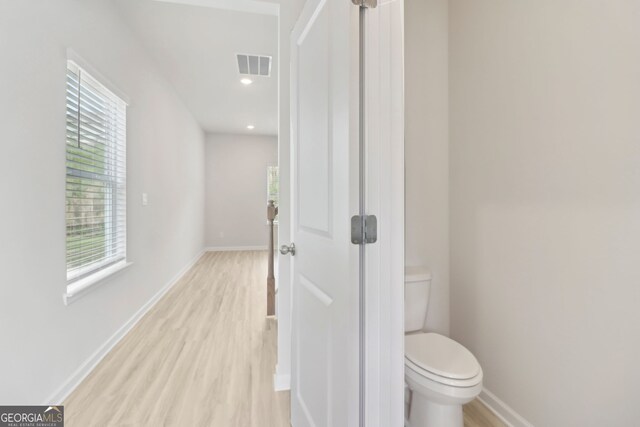 2764 Aralynn Way, College Park, GA 30337 - bathroom featuring toilet, visible vents, wood finished floors, and baseboards