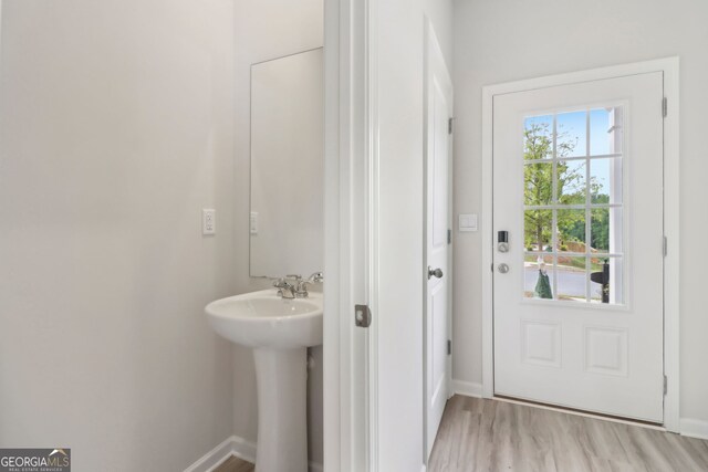 2764 Aralynn Way, College Park, GA 30337 - bathroom with baseboards, a sink, and wood finished floors