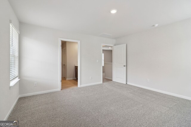 2764 Aralynn Way, College Park, GA 30337 - unfurnished bedroom featuring baseboards, multiple windows, recessed lighting, and carpet floors
