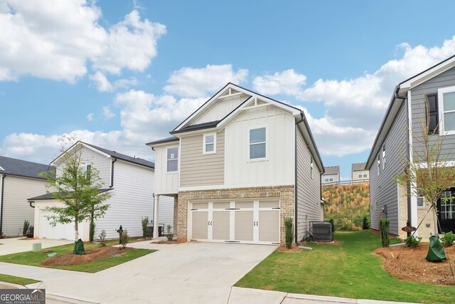 2764 Aralynn Way, College Park, GA 30337 - craftsman-style house featuring brick siding, driveway, a garage, cooling unit, and board and batten siding