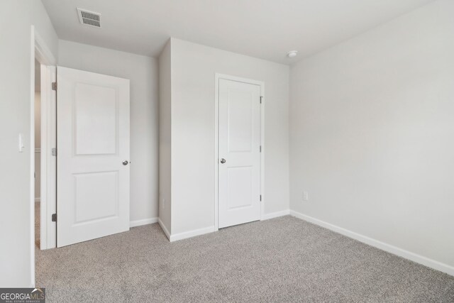 2764 Aralynn Way, College Park, GA 30337 - unfurnished bedroom with carpet flooring, visible vents, and baseboards