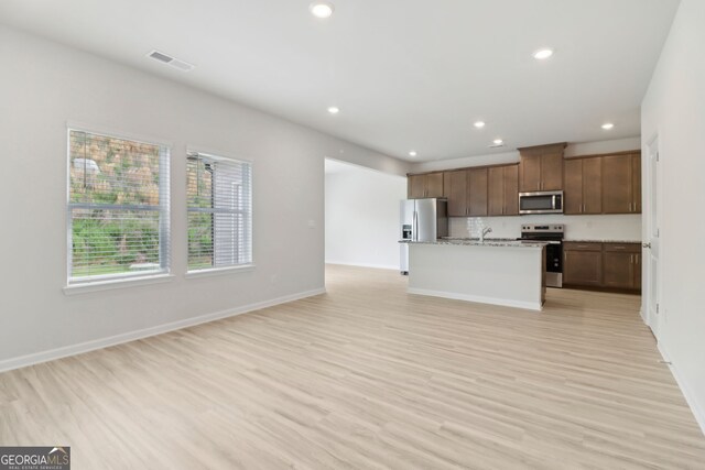 2764 Aralynn Way, College Park, GA 30337 - kitchen featuring recessed lighting, visible vents, open floor plan, light wood-style floors, and stainless steel appliances