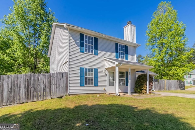 805 Old Rocky Rd, Atlanta, GA 30349 - traditional home with fence, a front lawn, and a chimney