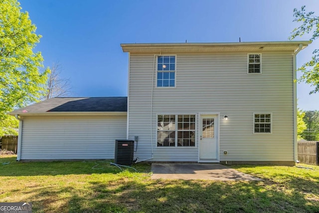 805 Old Rocky Rd, Atlanta, GA 30349 - rear view of property with a patio area, a lawn, central AC, and fence