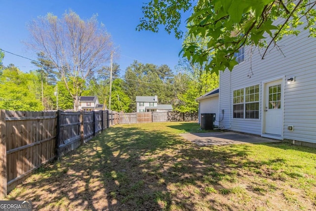 805 Old Rocky Rd, Atlanta, GA 30349 - view of yard featuring a fenced backyard, central AC unit, and a patio area