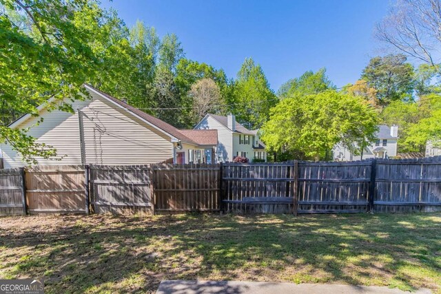 805 Old Rocky Rd, Atlanta, GA 30349 - view of yard with a fenced backyard