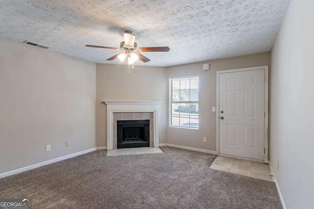 805 Old Rocky Rd, Atlanta, GA 30349 - unfurnished living room featuring a textured ceiling, carpet, visible vents, and a ceiling fan