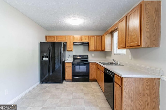 805 Old Rocky Rd, Atlanta, GA 30349 - kitchen featuring a sink, a textured ceiling, black appliances, light countertops, and range hood