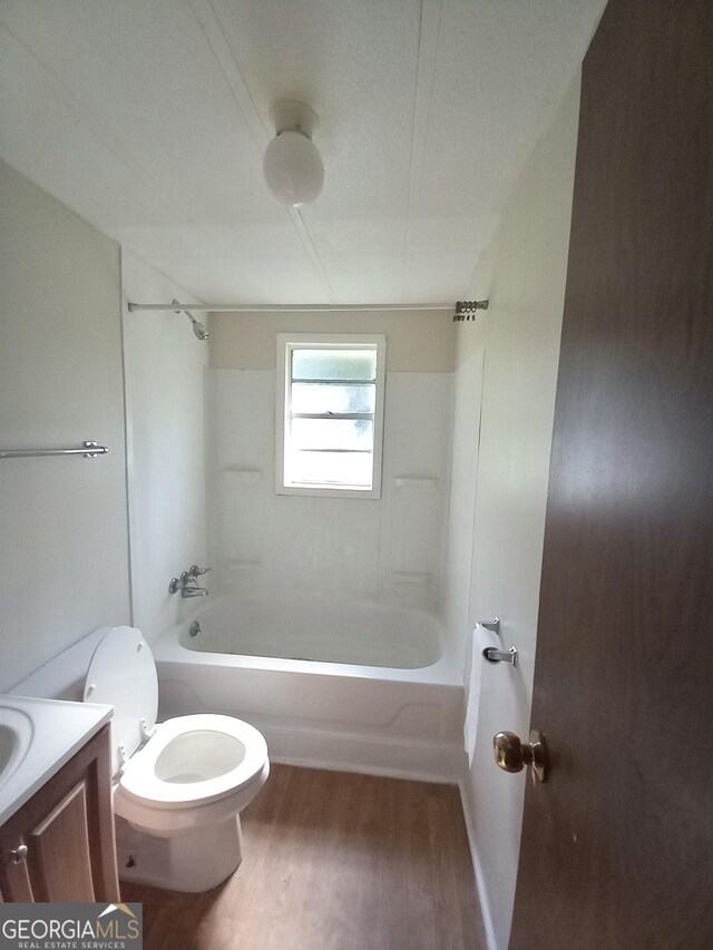 339 Gwenda St, Adrian, GA 31002 - bathroom with vanity, toilet, wood finished floors, and  shower combination