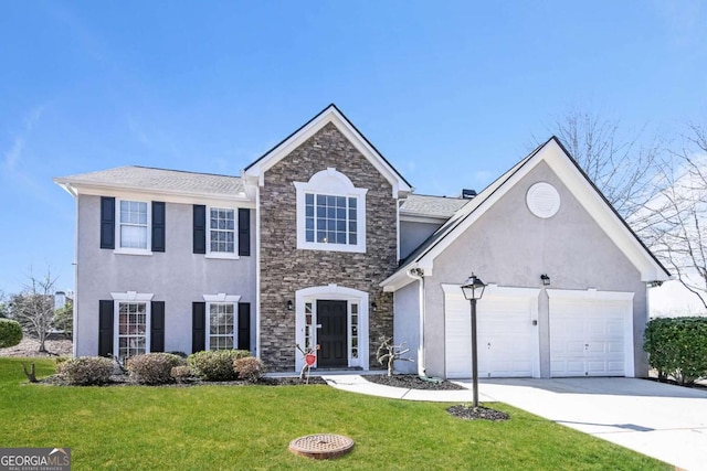 7636 Cole Ln, Atlanta, GA 30349 - view of front of house with stone siding, stucco siding, driveway, an attached garage, and a front lawn