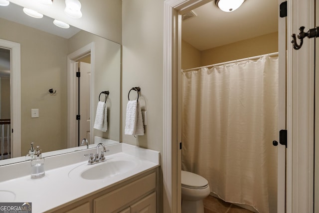 bathroom featuring tile patterned flooring, vanity, toilet, a shower with shower curtain, and visible vents