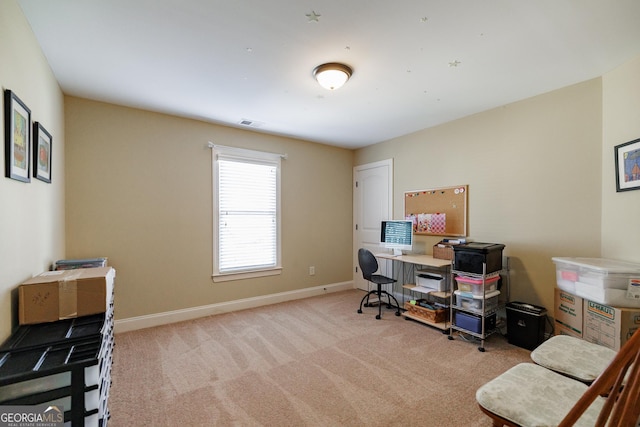 carpeted office with baseboards