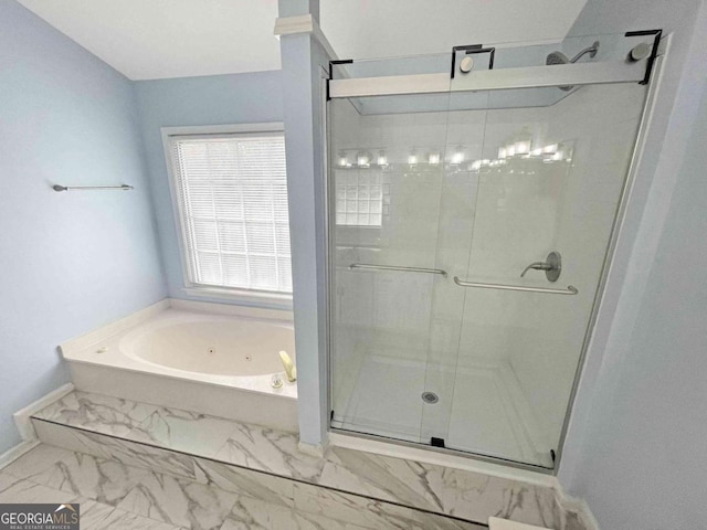 bathroom with a whirlpool tub, baseboards, marble finish floor, and a stall shower