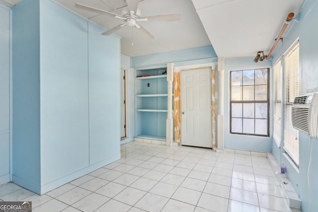 unfurnished bedroom featuring ceiling fan and light tile patterned flooring