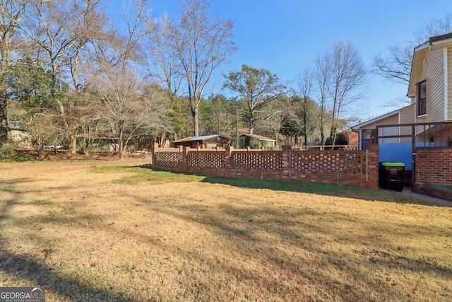 view of yard featuring fence