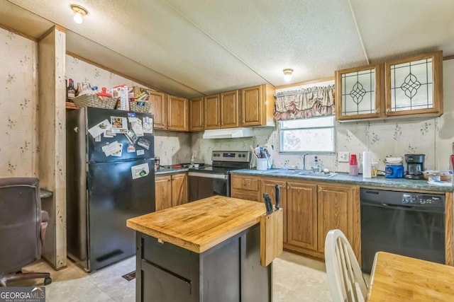 kitchen featuring a sink, freestanding refrigerator, wood counters, black dishwasher, and stainless steel electric range oven