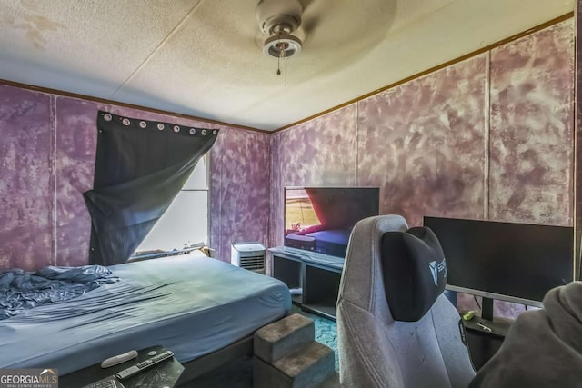 bedroom featuring wallpapered walls, a textured ceiling, ceiling fan, and crown molding