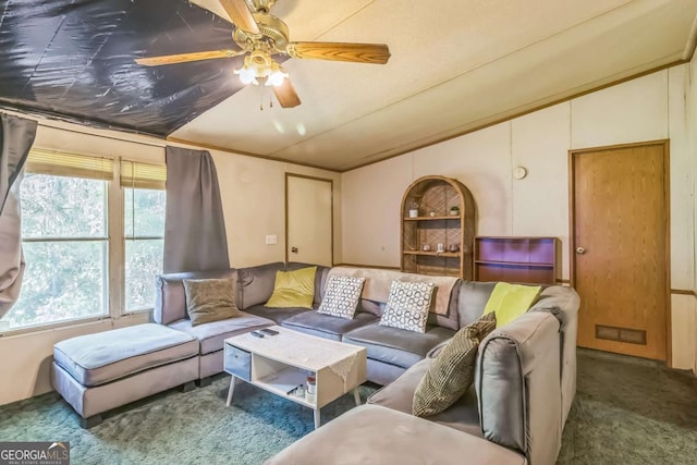 living area with lofted ceiling, a ceiling fan, carpet flooring, and visible vents
