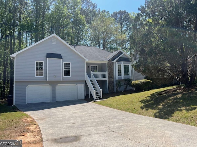 view of front of home with a front lawn, driveway, a porch, an attached garage, and stairway