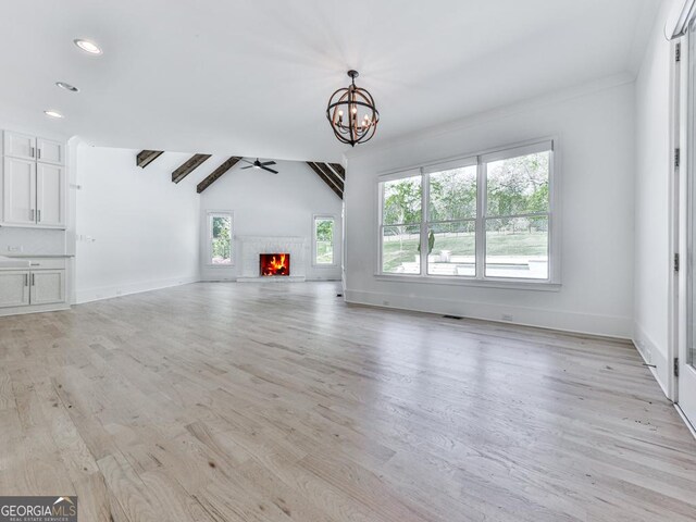 2535 Lake View Ct, Milton, GA 30004 - unfurnished living room with vaulted ceiling, a chandelier, light wood-style flooring, baseboards, and recessed lighting