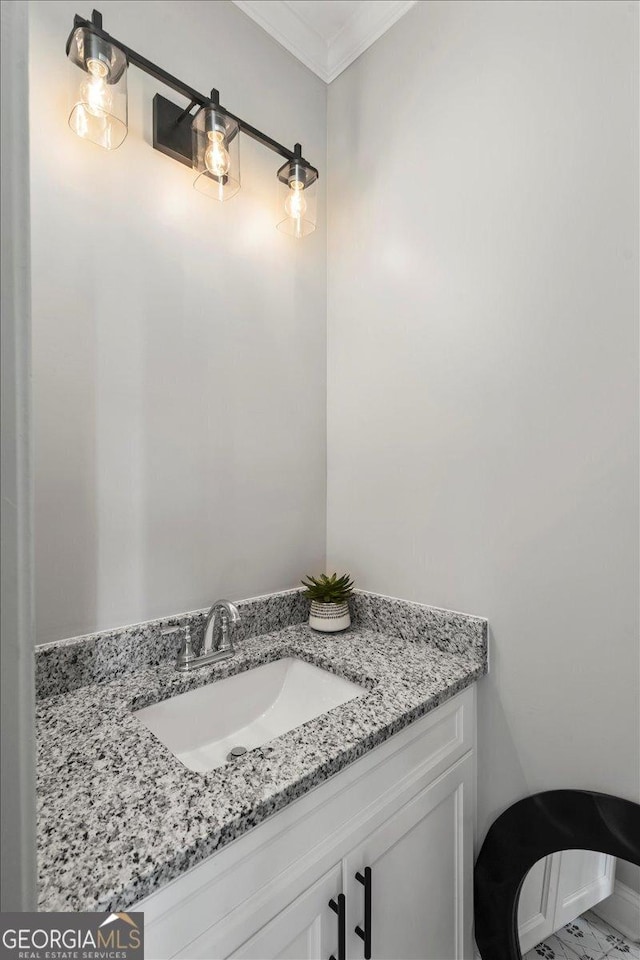 323 S Madison Ave, Monroe, GA 30655 - bathroom with vanity and ornamental molding