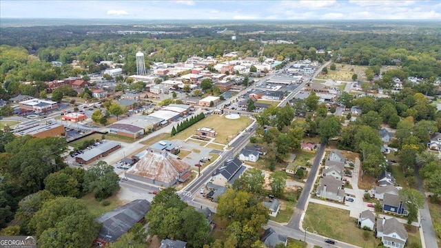 323 S Madison Ave, Monroe, GA 30655 - aerial overview of property's location featuring a forest and nearby suburban area