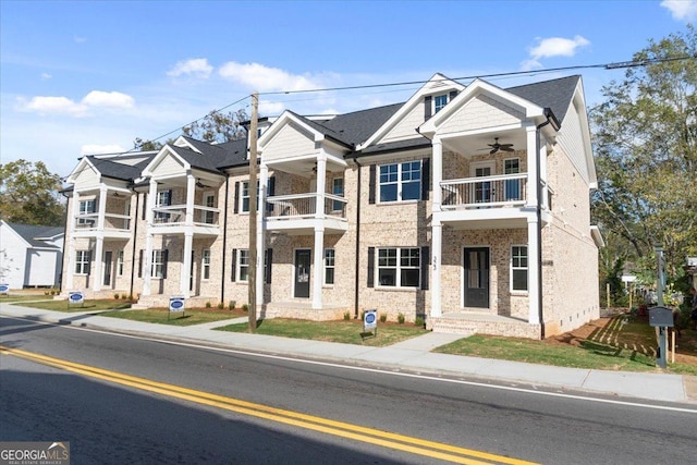 323 S Madison Ave, Monroe, GA 30655 - view of front of house featuring a ceiling fan, a balcony, and brick siding