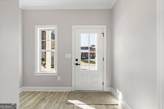 323 S Madison Ave, Monroe, GA 30655 - doorway featuring light wood-style flooring, plenty of natural light, baseboards, and crown molding