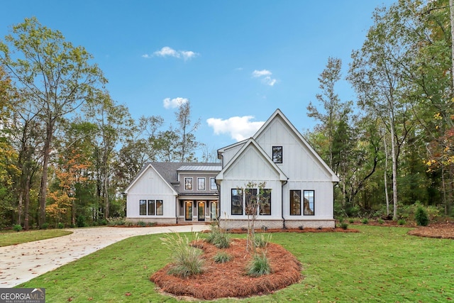 117 Wildwood Dr, Eatonton, GA 31024 - modern inspired farmhouse featuring board and batten siding and a front lawn