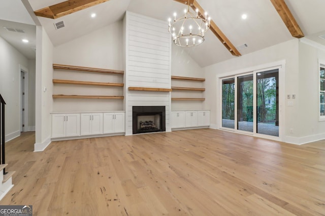 117 Wildwood Dr, Eatonton, GA 31024 - unfurnished living room with high vaulted ceiling, a chandelier, baseboards, beam ceiling, and visible vents