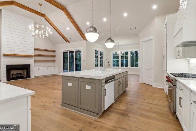 117 Wildwood Dr, Eatonton, GA 31024 - kitchen with custom exhaust hood, a sink, high end stainless steel range oven, dishwashing machine, and recessed lighting